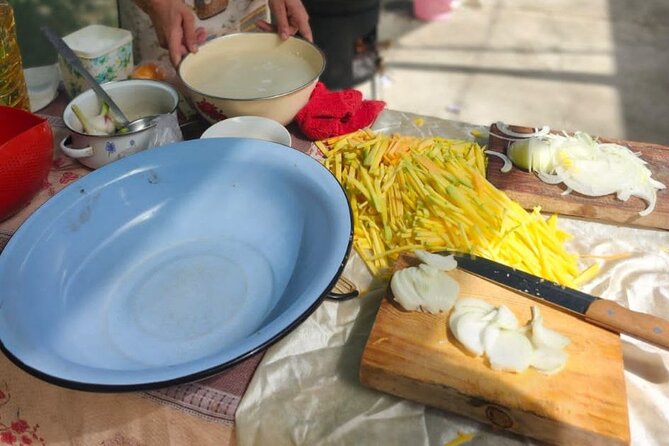 Cooking Class in the Village with Local Family in Samarkand - Konigil adds paper, oil, and pottery