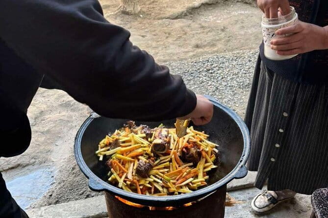 Plov Cooking Class at Local Uzbek House - Preparing plov in a traditional qozon